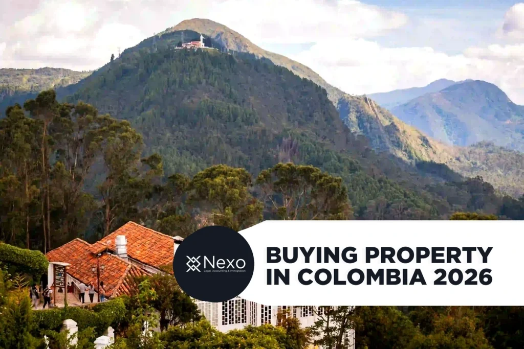 buying property in Colombia 2026 — foreigner reviewing property documents with Colombian notary