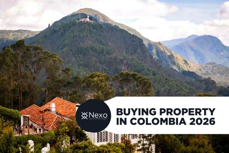 buying property in Colombia 2026 — foreigner reviewing property documents with Colombian notary