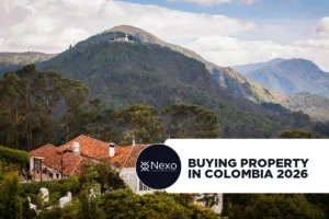 buying property in Colombia 2026 — foreigner reviewing property documents with Colombian notary