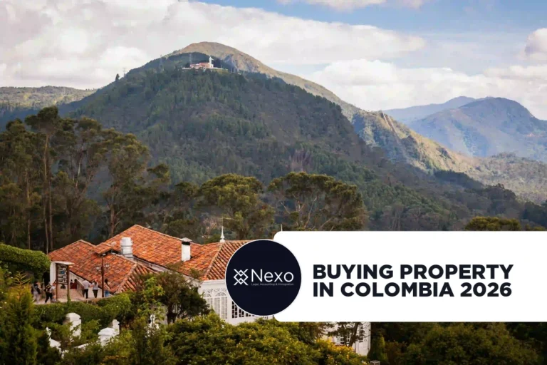 buying property in Colombia 2026 — foreigner reviewing property documents with Colombian notary