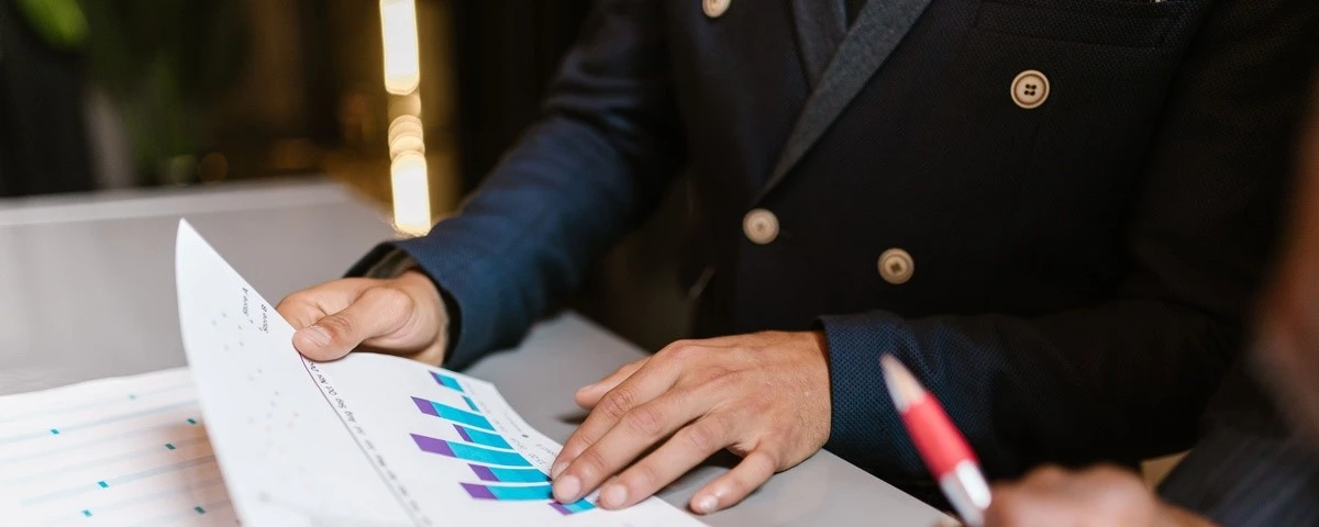Wealth Tax in Colombia 2026: Who Has to Pay It (And Why the Number You've Seen Might Be Wrong) Tax advisory office reviewing financial charts and documents for Colombia wealth tax and DIAN filing calendar