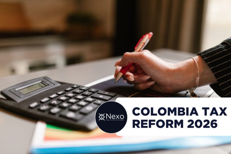 reforma tributaria 2026 Colombia - empresario extranjero revisando cambios tributarios con asesor