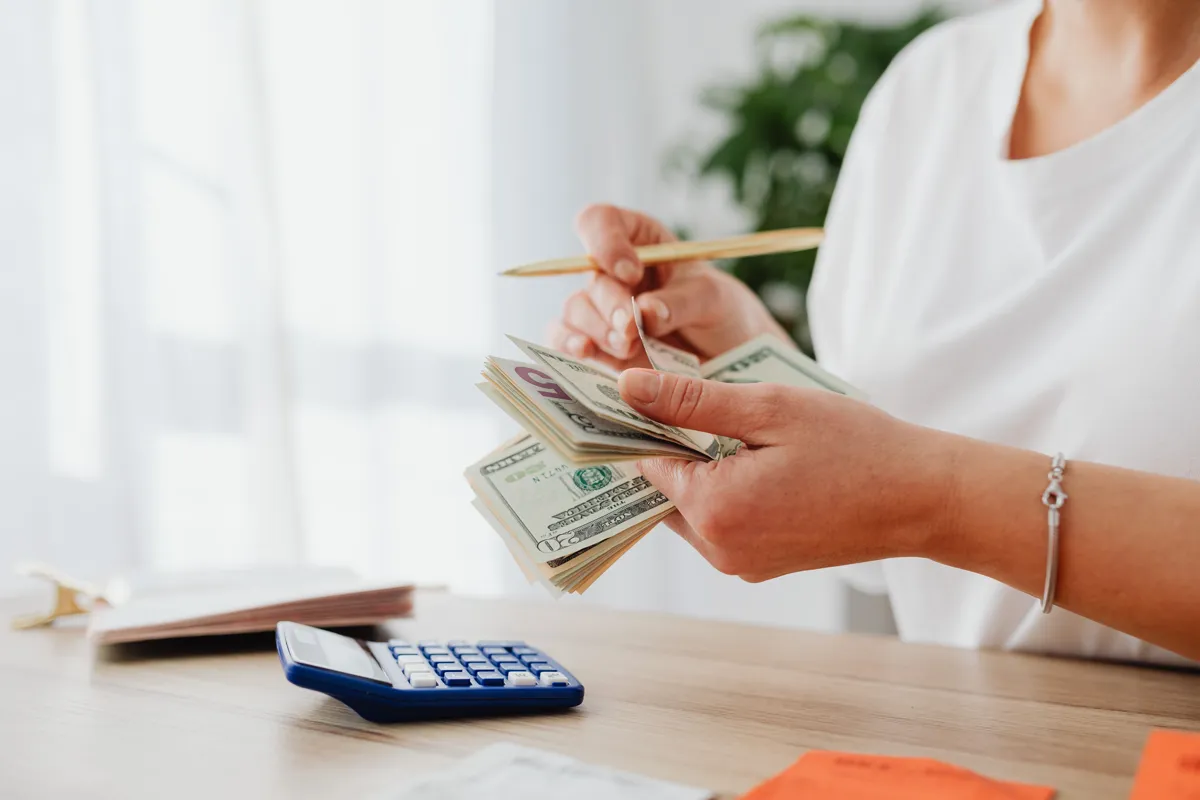 Colombia Retirement Visa 2026: Why Your Pension Might Not Be Enough Anymore colombia retirement visa - retiree counting dollars against the peso threshold