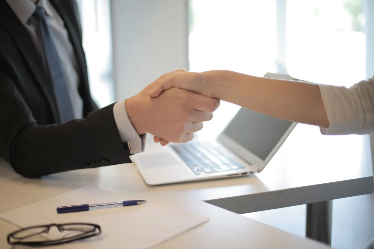 Criminal Record Certificate for Your Colombian Visa: A Country-by-Country Guide immigration lawyer reviewing a visa file with a client