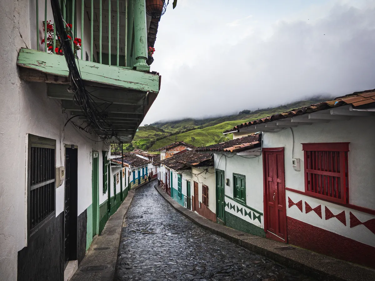cobblestone street in a Colombian town after a rain