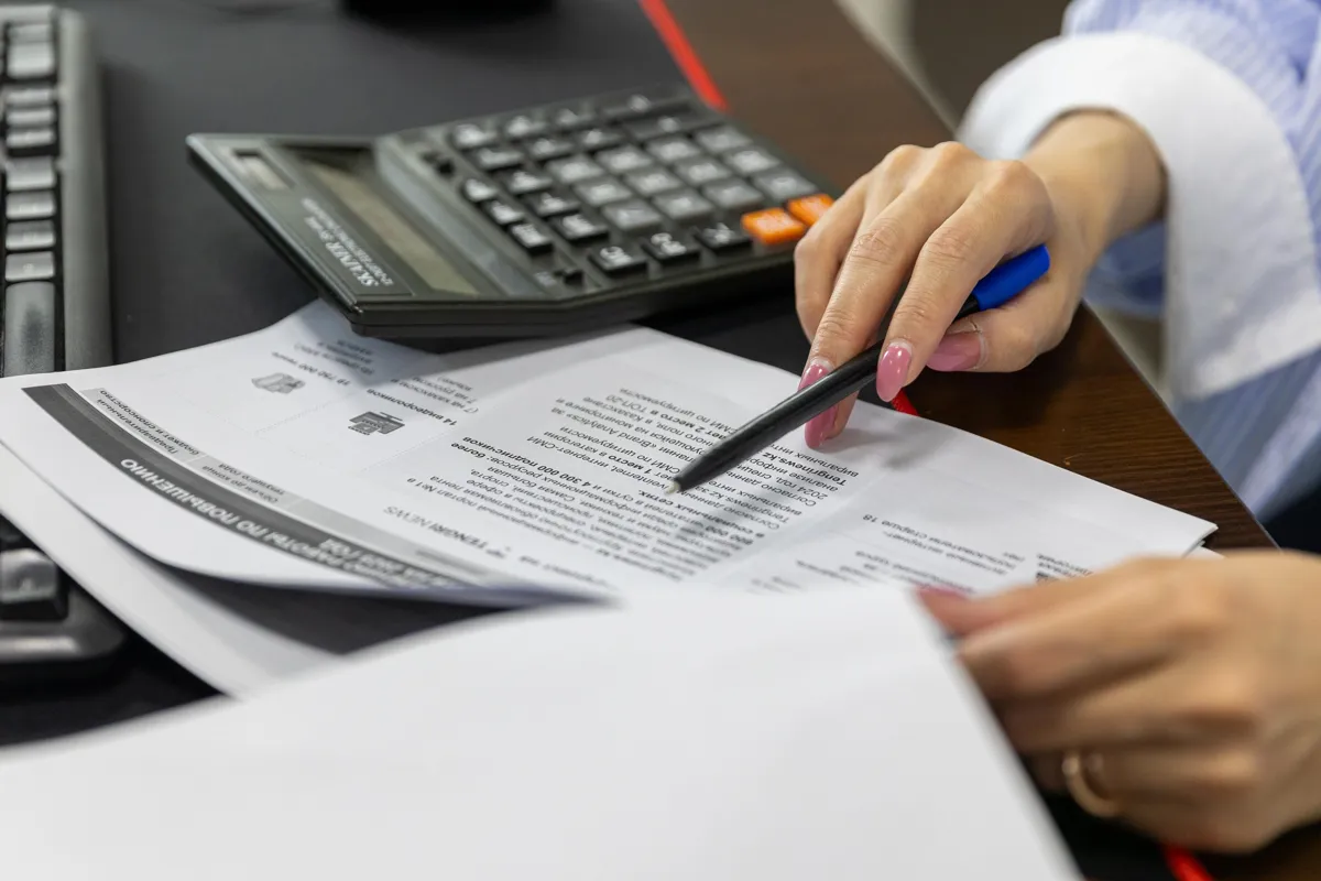 withholding tax in Colombia - accountant reviewing self-withholding rates